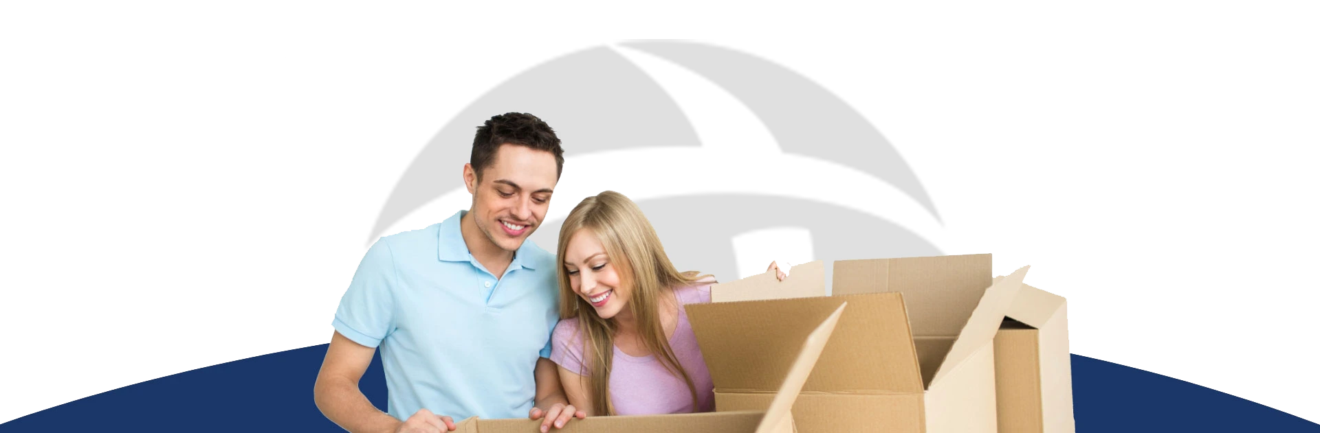 A couple is packing personal belongings into boxes and getting ready to move.